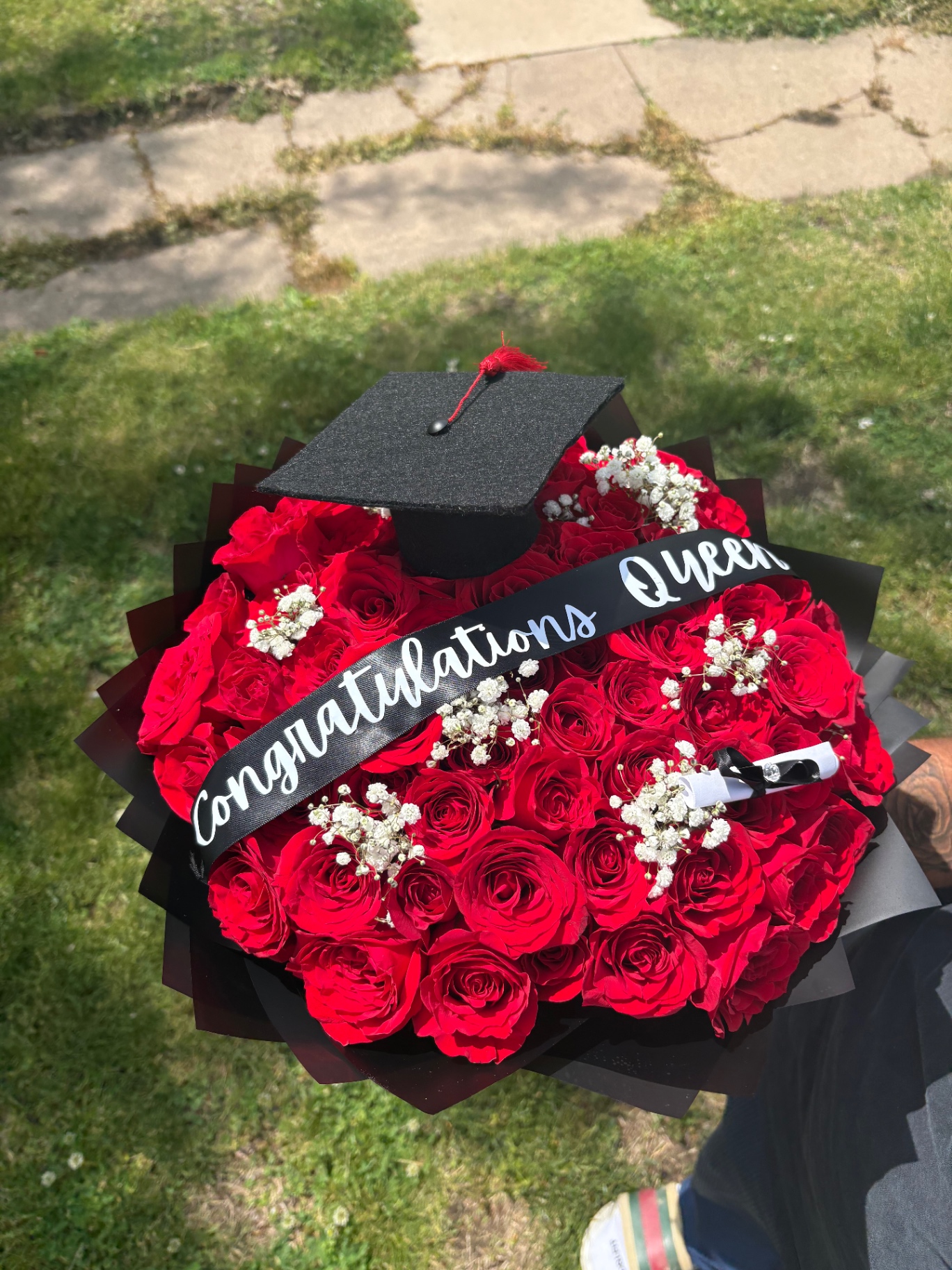 Graduation bouquet of red roses with Congratulations Queen sash